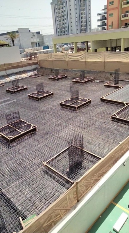 Raft reinforcement with column starter bars set in timber boxes